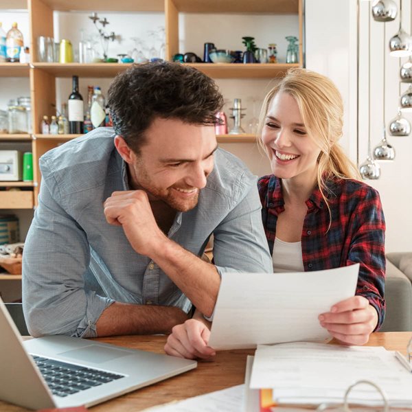 Smiling couple with paperwork