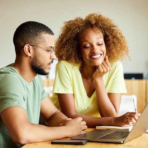 Couple looking at laptop